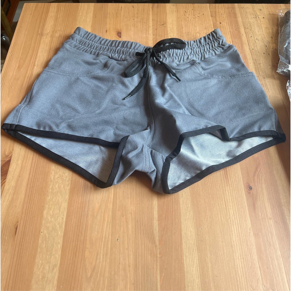 Gray shorts. 2 pockets drawstring elastic waist band.